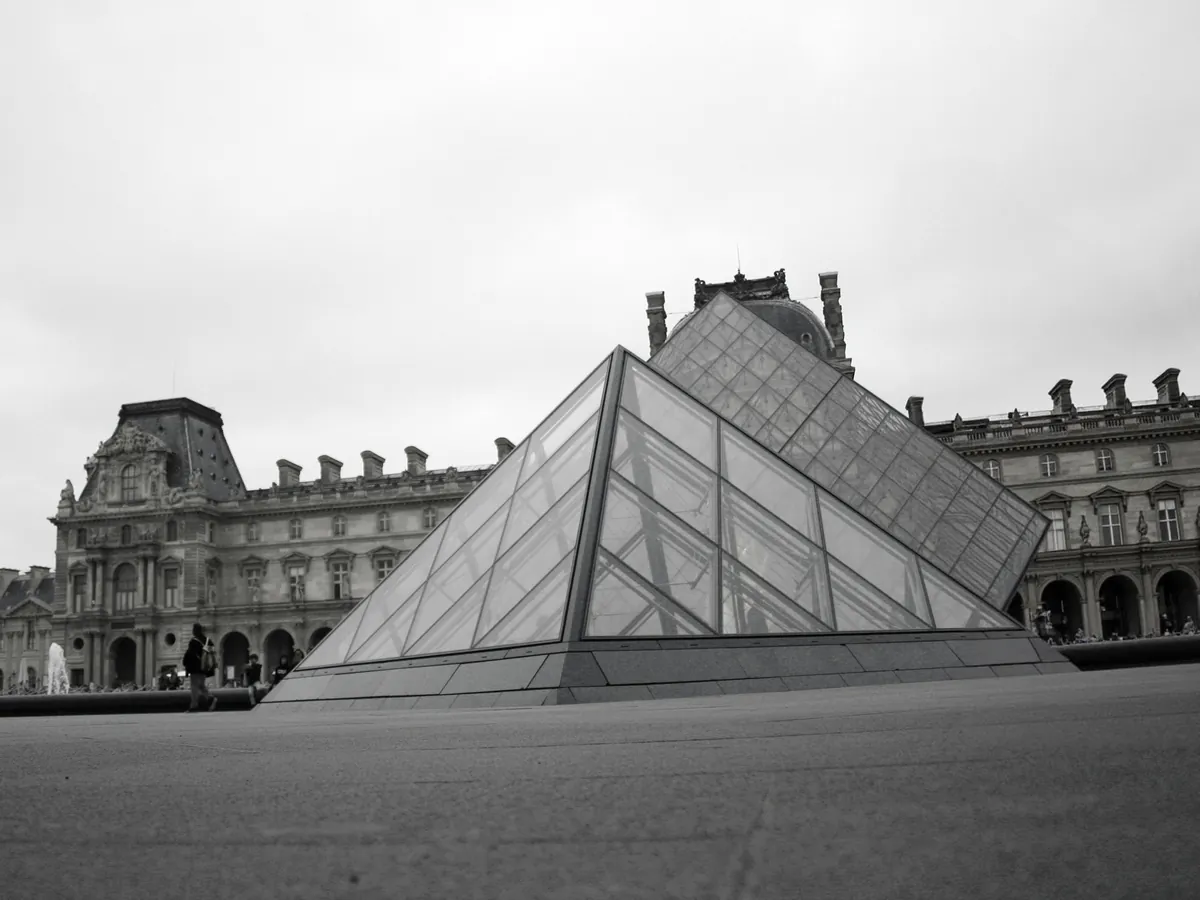 Scooter rider who rode into a Louvre pyramid photo, removed